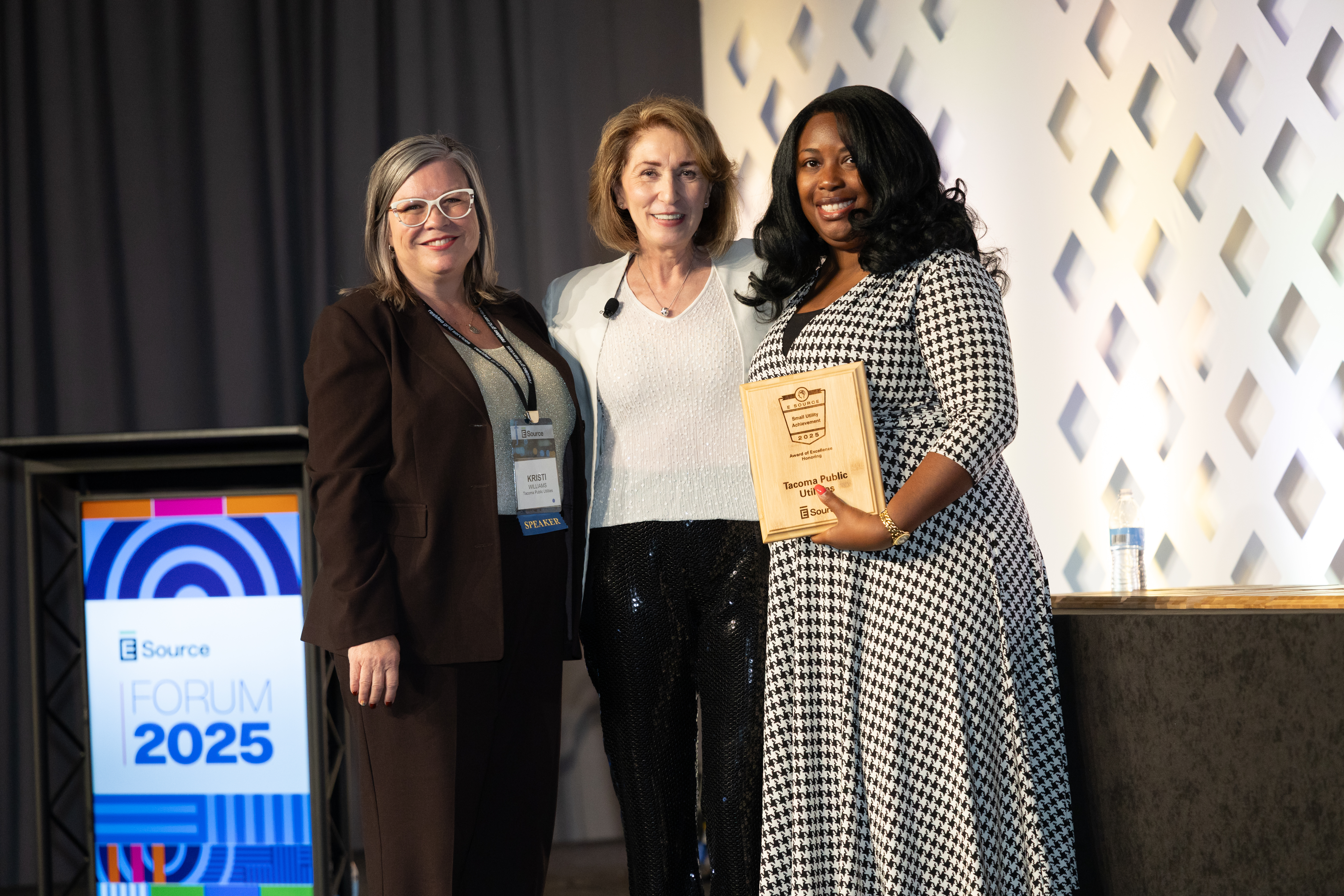 Attendees accepting the Small Utility Excellence Award at Forum.
